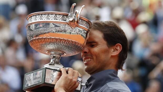 Nadal lifts the trophy as he celebrates his win against Austria's Dominic Thiem. Picture: AP
