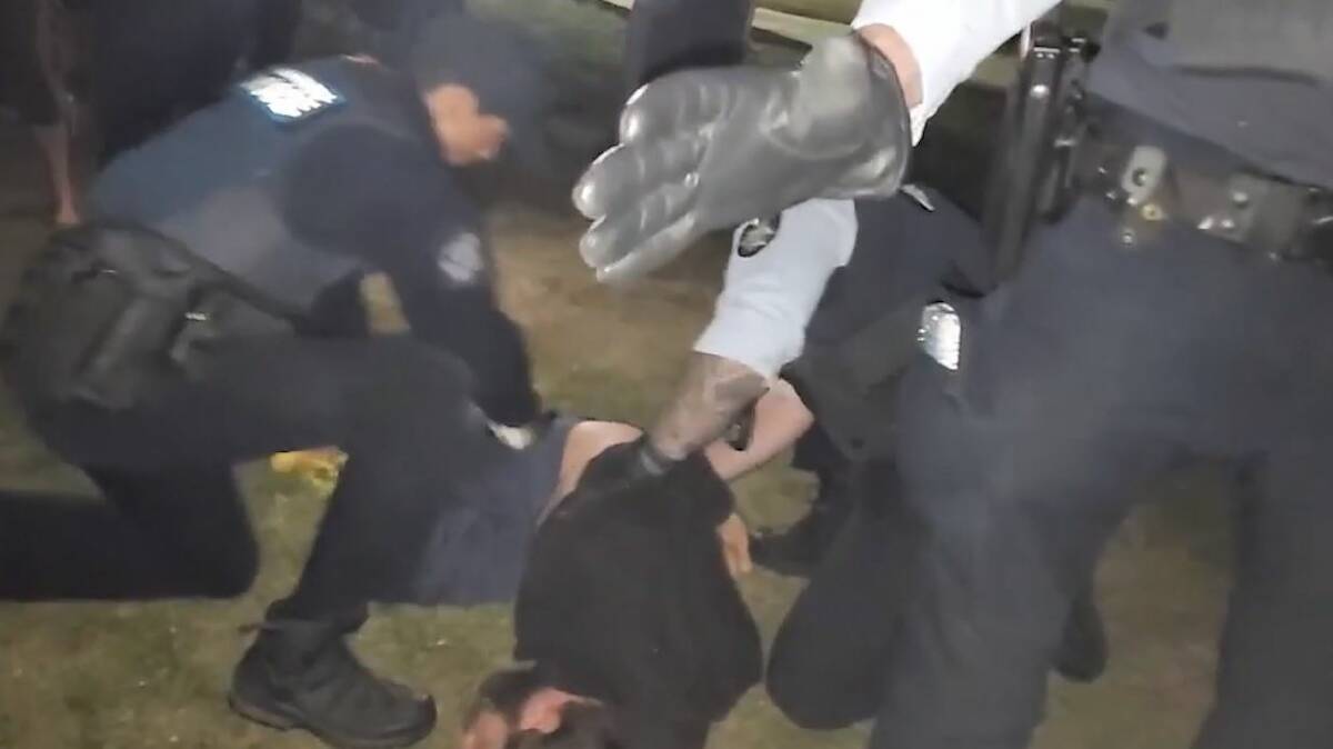 A protester is arrested on Tuesday night. Picture: Screenshot