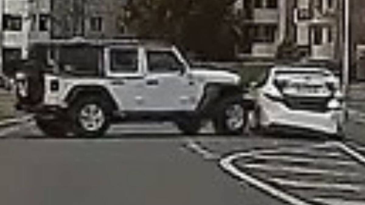 A screenshot from a video of a Jeep ramming a Corrective Services car.