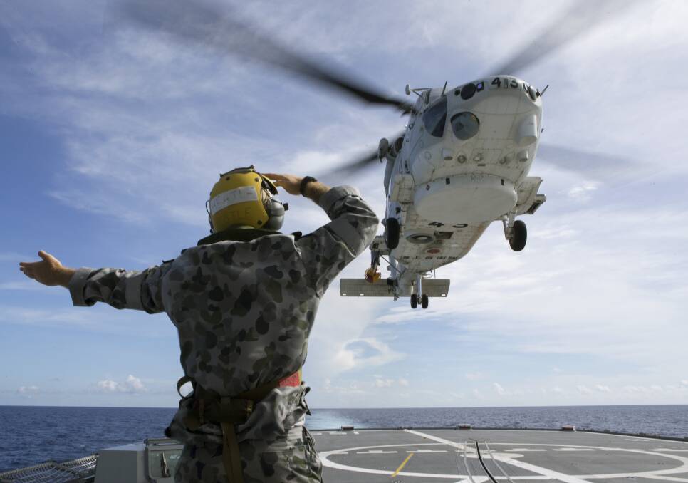 A Japanese Seahawk takes off from HMAS Ballarat during an exercise in the South China Sea. Picture: Defence Media