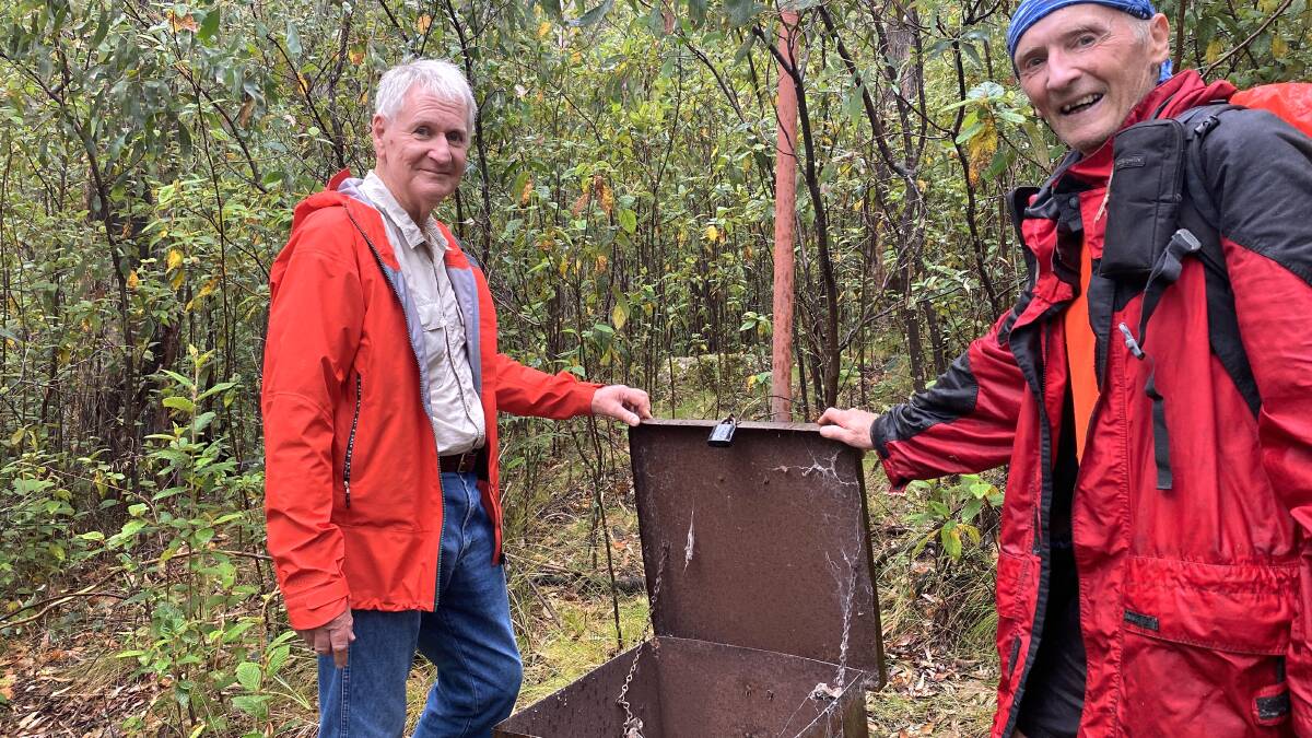 Peter Hann and John Evans inspect the Tidbinbilla siren. Picture by Tim the Yowie Man