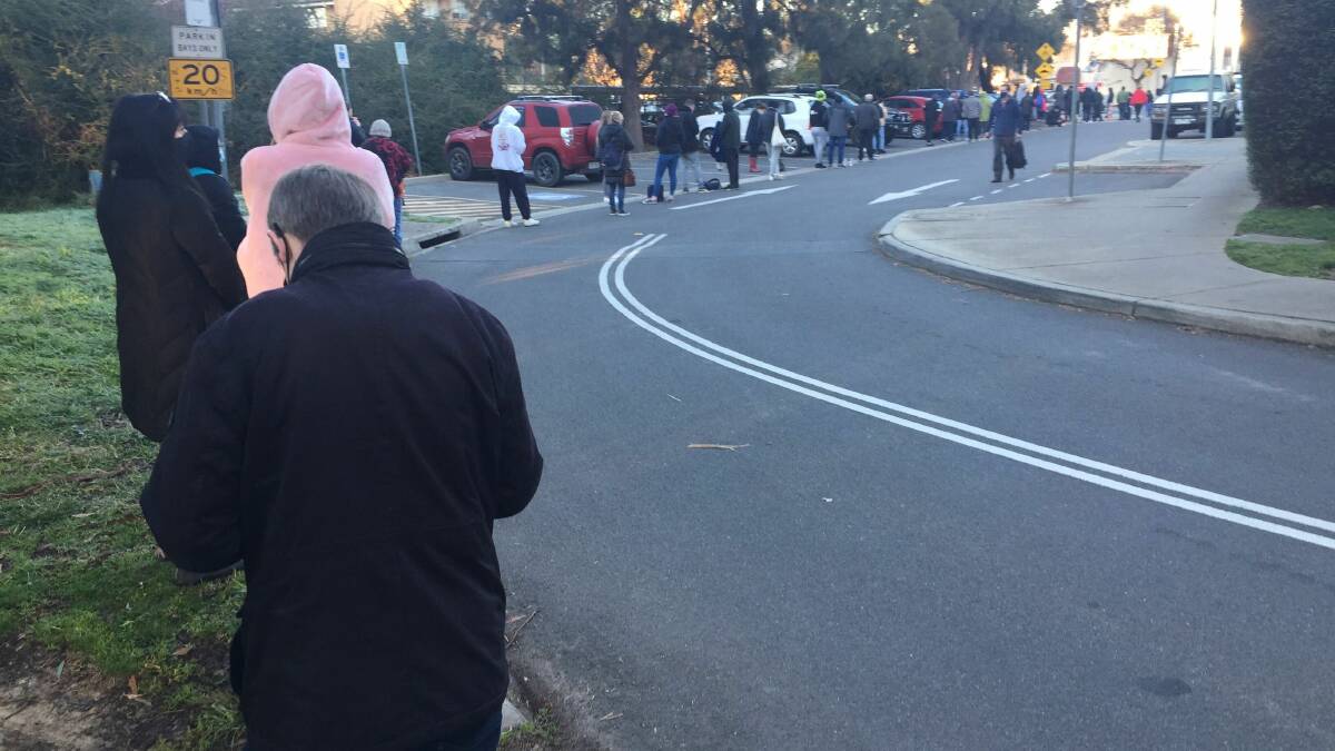 Long queues at the O'Connor testing site before it opened. Picture: Scott Hannaford