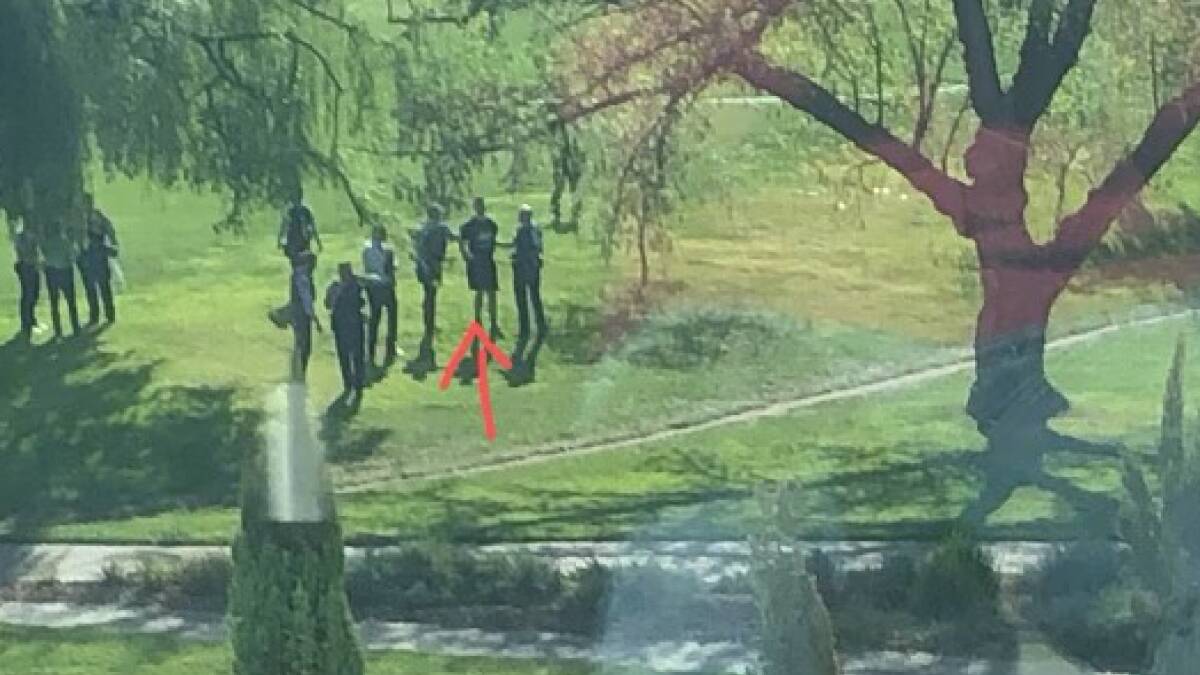 An image said to show police taking a man into custody after an alleged stabbing at the ANU. Picture supplied
