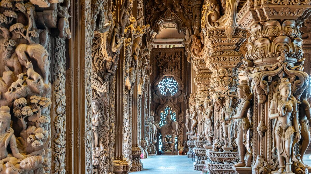 Carved wooden statues adorning the walls inside the Sanctuary of Truth. Picture by Michael Turtle
