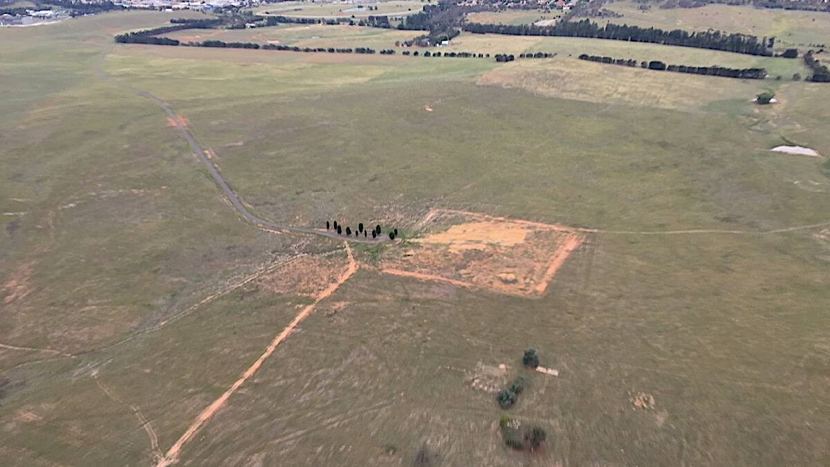 This bare patch in a paddock near Hume was once a covert communications complex. Picture: Bryce England
