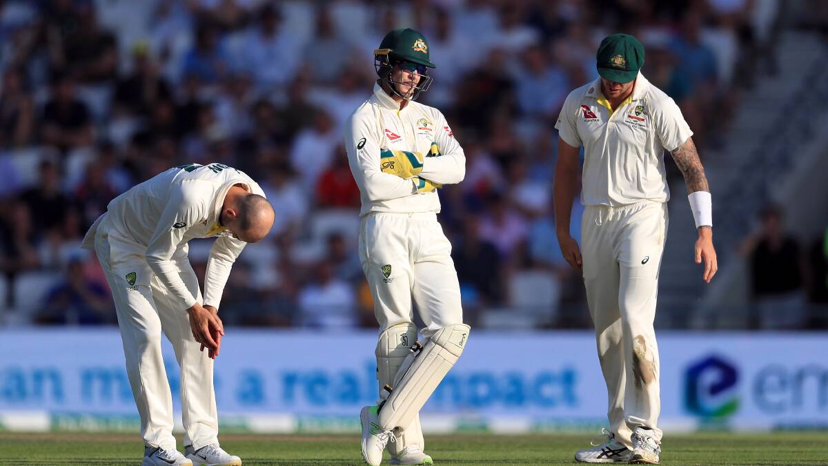 Australia's Nathan Lyon, left, Tim Paine, centre, and James Pattinson during day three of the third Ashes Test match. Picture: PA