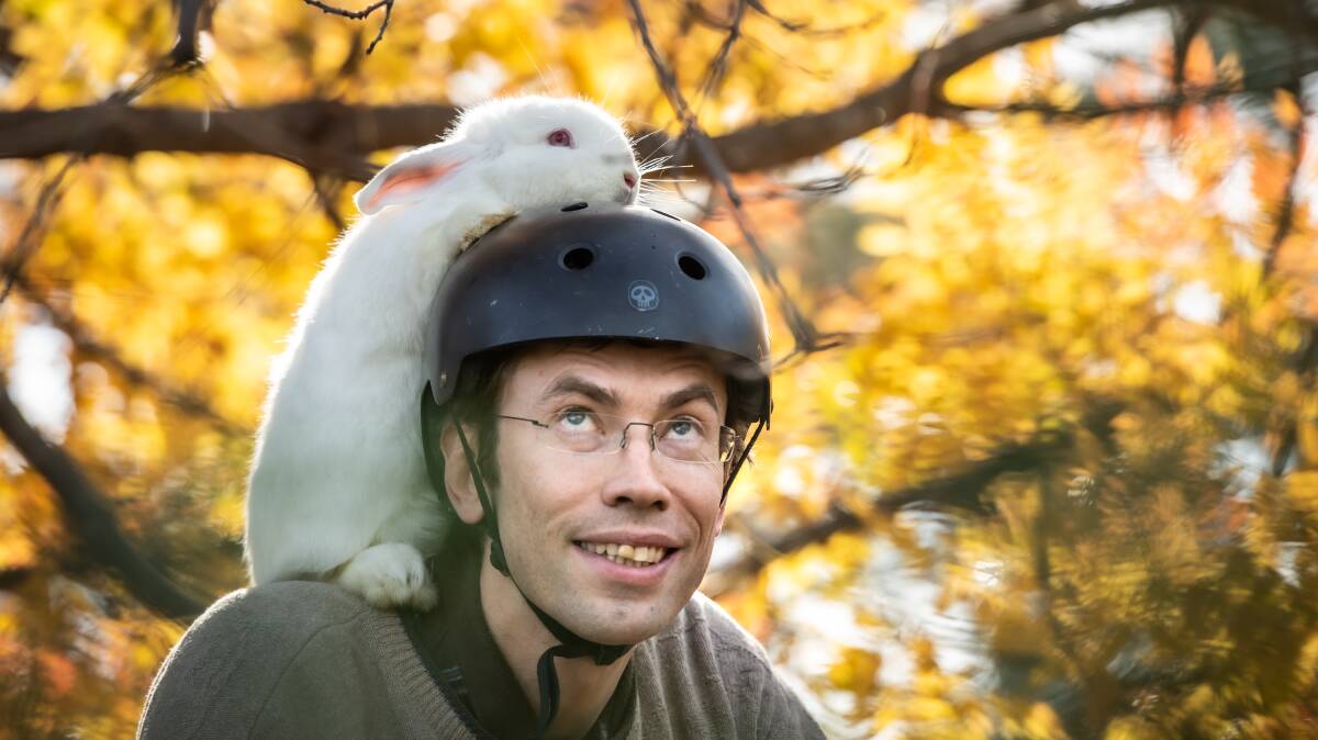 Chris Schlegel and his rabbit Max Bugden enjoy bike riding around the Campbell area together. Picture: Karleen Minney