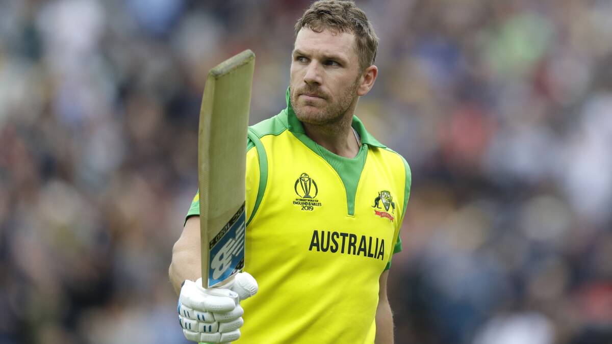 Australia's captain Aaron Finch holds up his bat to applause as he leaves the pitch after he is caught by Sri Lanka's captain Dimuth Karunaratne for 153. Picture: AP