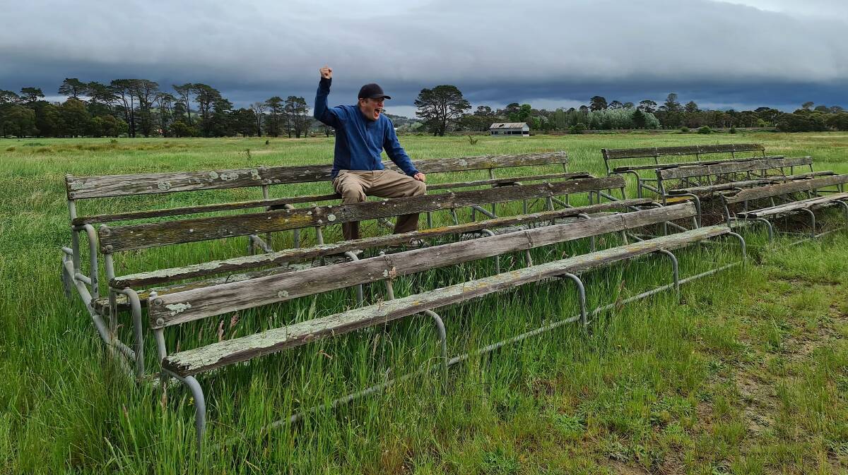 Daniel Newton of Amaroo cheers-on from the ghostly grandstand at the Bushranger Reserve near Collector. Picture: Naomi Iris