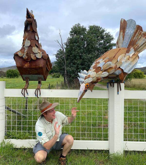 Tim with "Gloria", Fred McGrath Weber's hen sculptures at the farm gate to Majura Valley Free Range Eggs. Picture by Sarah Marley