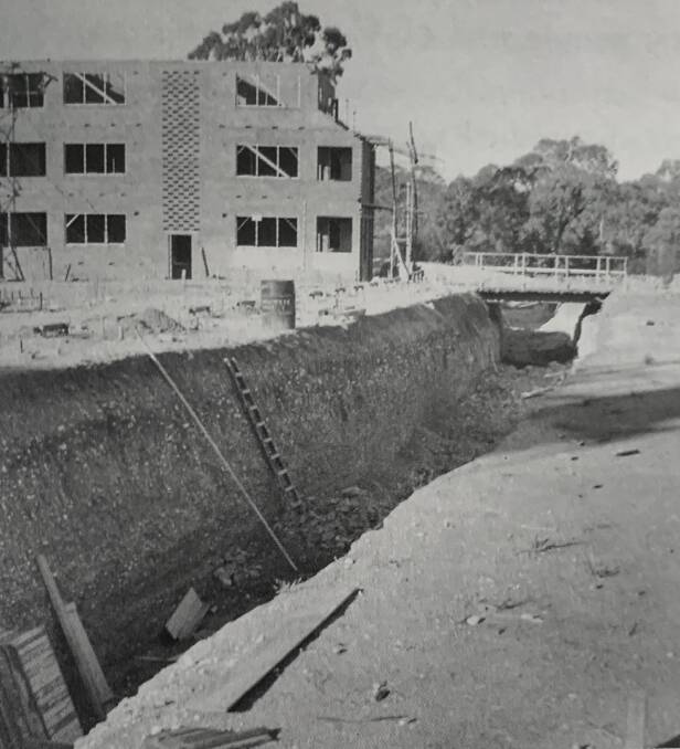 The service tunnel under University House, built to withstand a nuclear blast has harboured many a good bottle of red. It runs under the building near the fish pond. Picture: ANU Archives