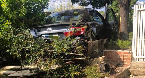 Two teenage boys will face court after a stolen vehicle crashed into the front yard of a Nicholls home on Sunday morning. Picture supplied.