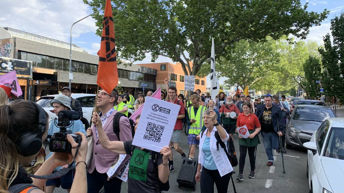 Extinction Rebellion protesters in Braddon on Friday morning. Picture: Andrew Brown