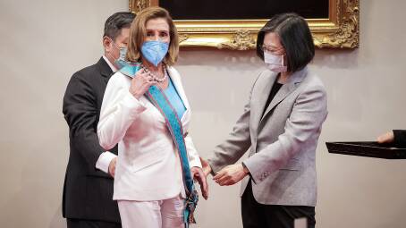 US Speaker Nancy Pelosi, centre, receives Taiwans highest civilian honour from Taiwan's President Tsai Ing-wen, right. Picture: Getty Images