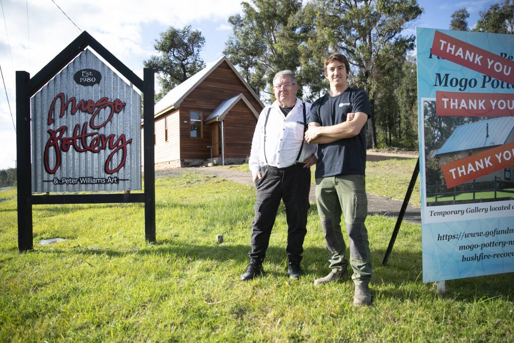 Potter and painter Peter Williams with builder Peter Jirgens at the rebuilt Mogo church. Picture: Keegan Carroll 