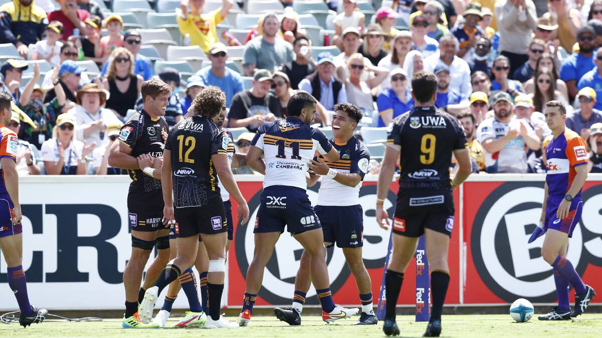 Tom Wright and Loah Lolesio celebrate the ACT Brumbies' first try on Sunday. Picture: Keegan Carroll