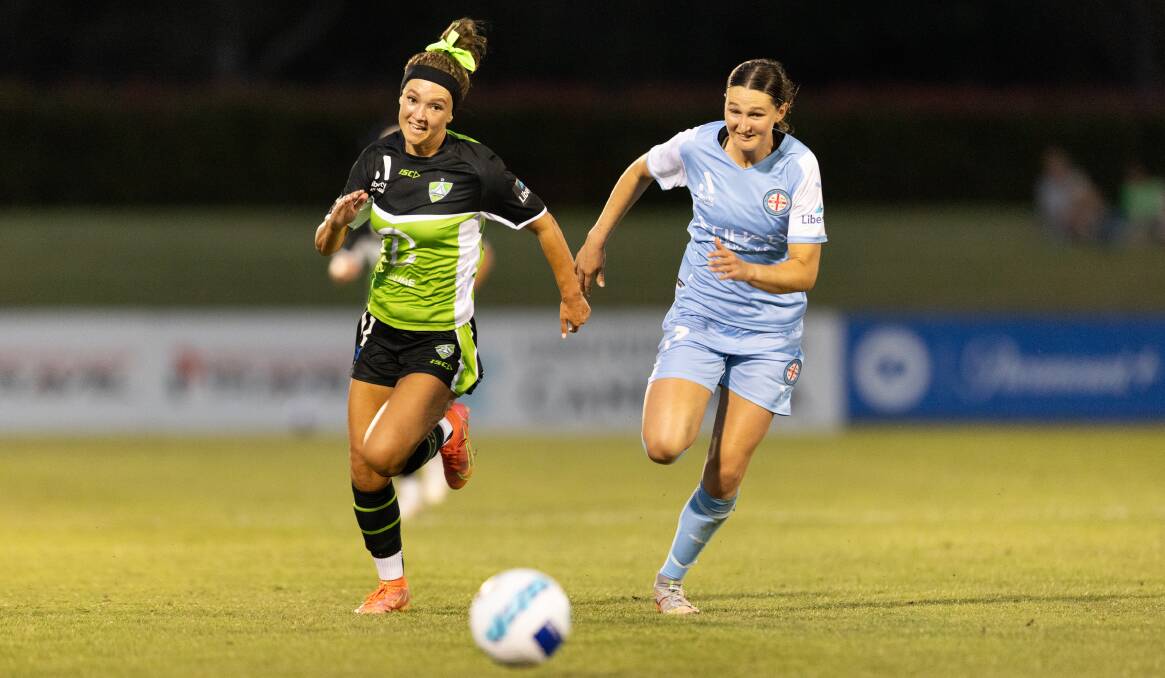 Canberra United's Chloe Middleton and Melbourne City's Winonah Heatley race to the ball at Viking Park. Picture: Sitthixay Ditthavong