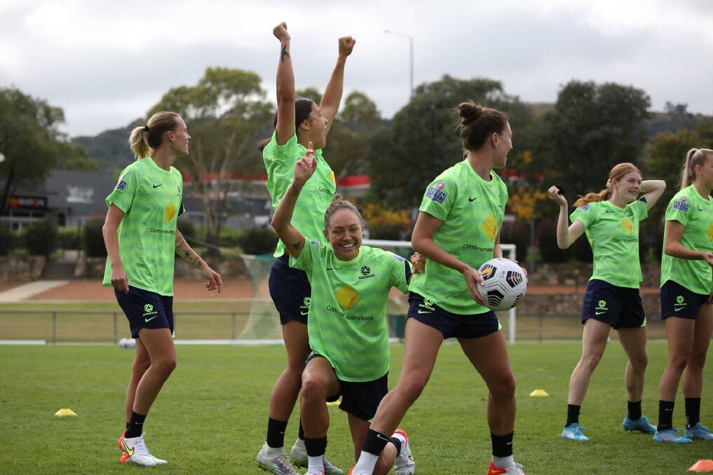 Emily van Egmond, Sam Kerr, Kyah Simon and Steph Catley celebrate during a game at training in Canberra. Picture: Football Australia