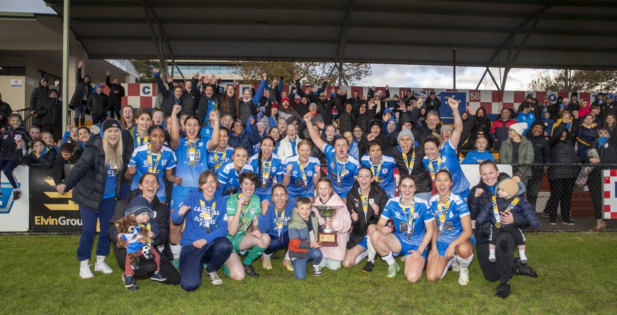 Canberra Olympic FC and their fans celebrate their Federation Cup win on Saturday afternoon. Picture: Keegan Carroll