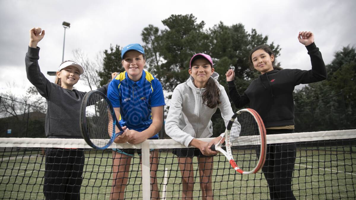 Zoe Cowles, 9, Zali Ilitch, 13, Alisha Kunar, 13, and Yuvani Chhetri, 11, at Canberra's tennis centre on Sunday after Ash Barty's win. Picture: Keegan Carroll