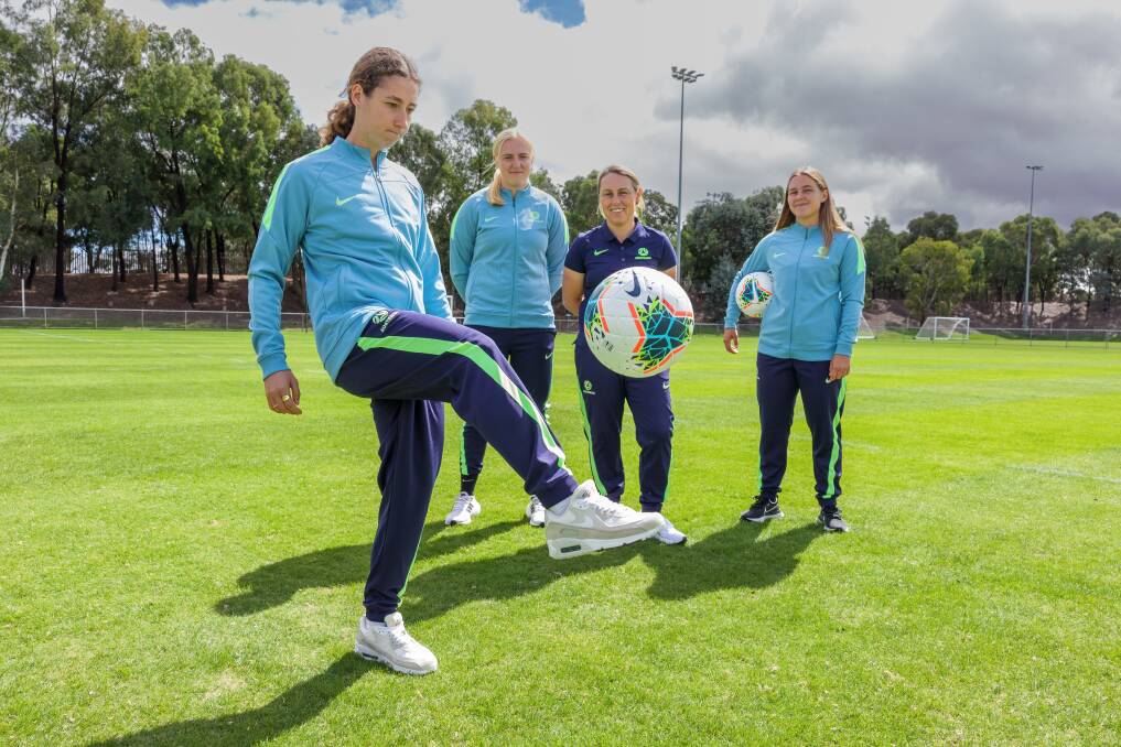 Young Matildas head coach Leah Blayney with players Sarah Hunter, Sally James, and Leticia McKenna. Picture: Sitthixay Ditthavong