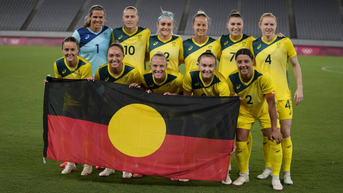 The Matildas posed for a team photo with the Aboriginal flag before their 2-1 win over New Zealand on Wednesday night. Picture: AP Photo/Ricardo Mazalan