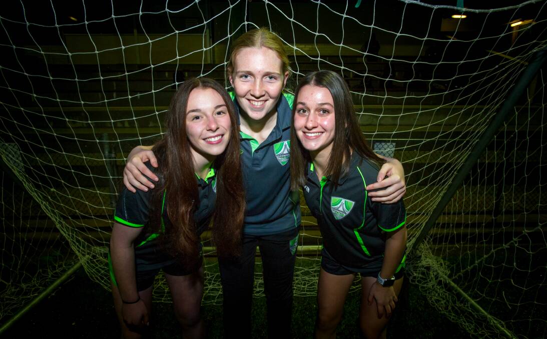 Canberra United Academy players Nikita Perry, Chloe Lincoln and Sofia Christopherson have high hopes for the Matilda's in Tokyo. Picture: Elesa Kurtz