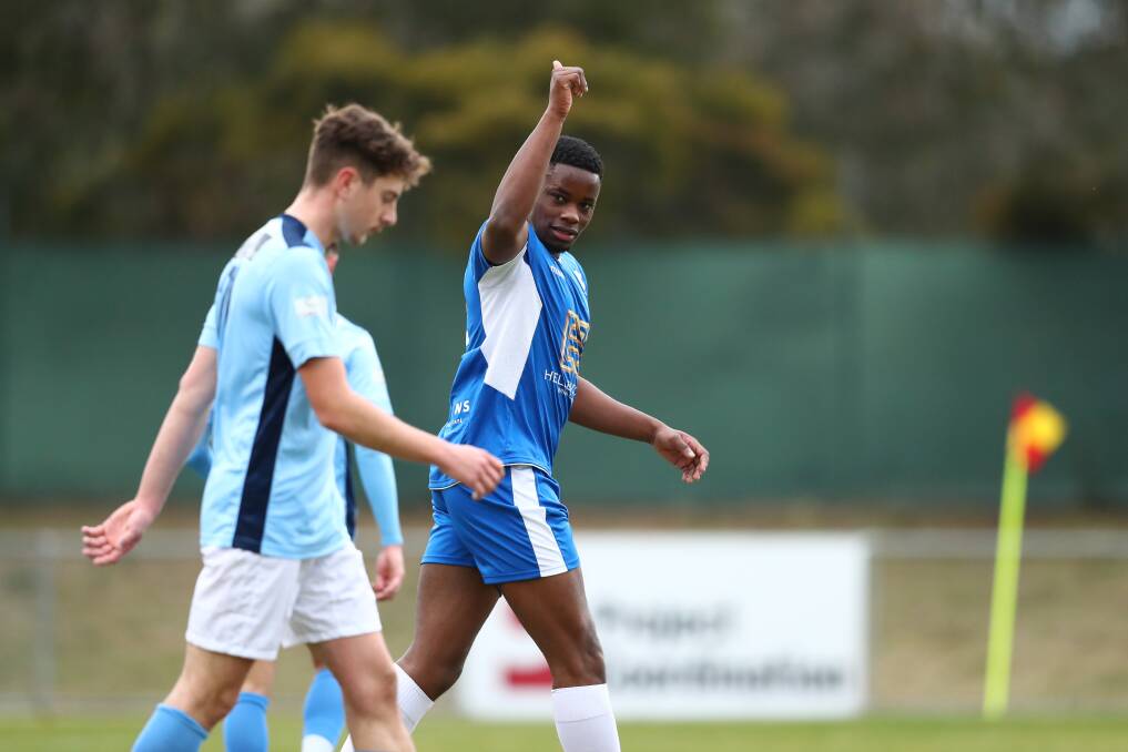 Canberra Olympic FC's goal scorer Aisosa Ihegie celebrates his goal against Belconnen United FC on Saturday. Picture: Keegan Carroll.
