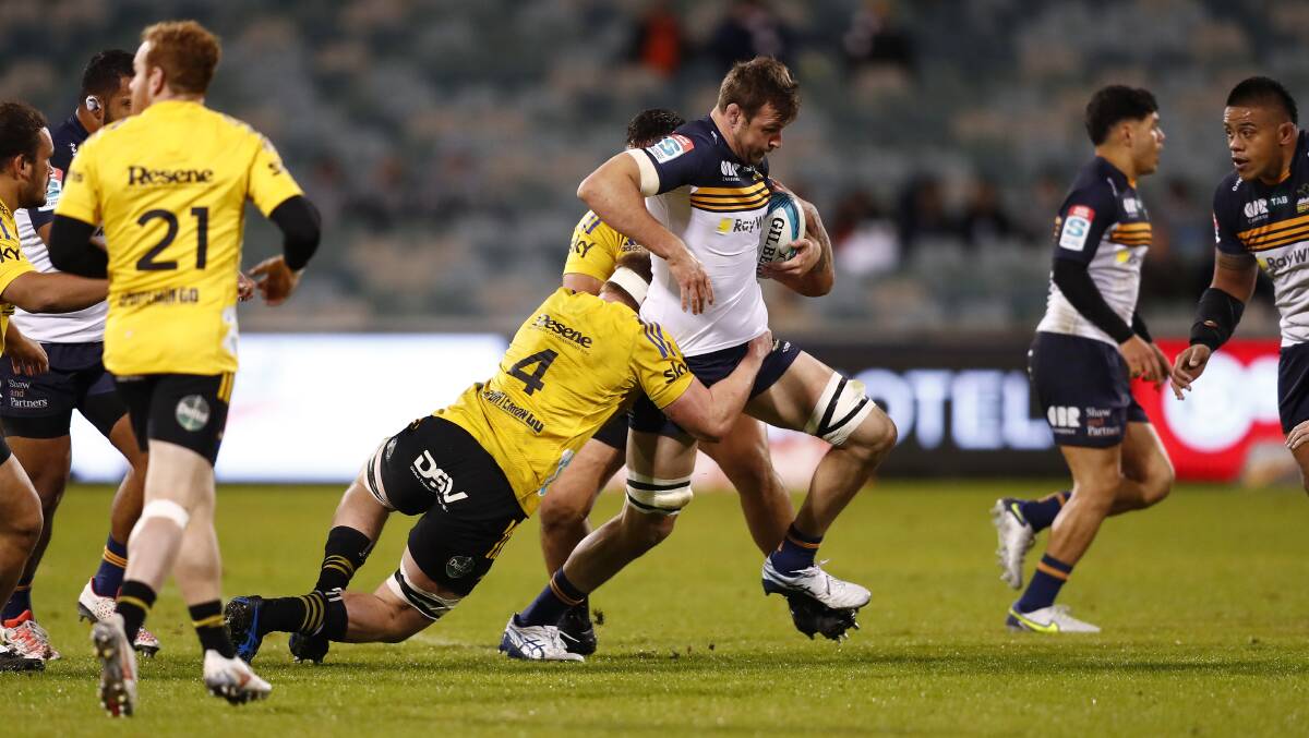 ACT Brumbies lock Nick Frost tries to break the line against the Wellington Hurricanes on Saturday night. Picture: Keegan Carroll