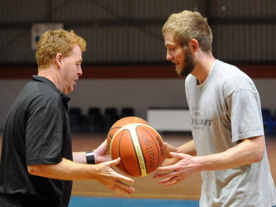 Perth Wildcats' Jesse Wagstaff, with his NBL coach Rob Beveridge, once he first signed in 2009. Picture: Chris Dutton