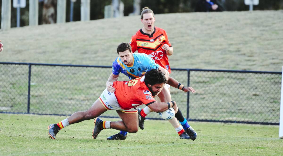 Jack Williams scores a try for the Gungahlin Bulls on Sunday. Picture: Dion Georgopoulos