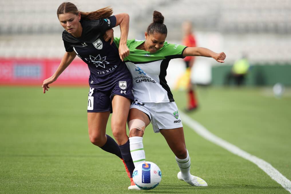Canberra United's Allira Toby is challenged by Sydney FC's Charlize Rule during the visitors' 6-0 loss. Picture: Getty