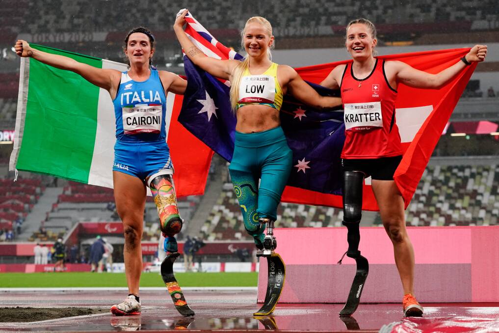 Canberra's Vanessa Low, pictured alongside second and third place, took out the T63 long jump on Thursday night in Tokyo. Picture: Getty