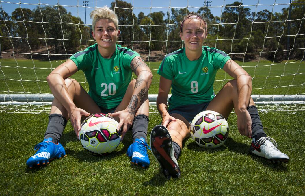 Michelle Heyman pictured with her former Matildas teammate Caitlin Foord, who is still playing in the national set up. Picture by Elesa Kurtz