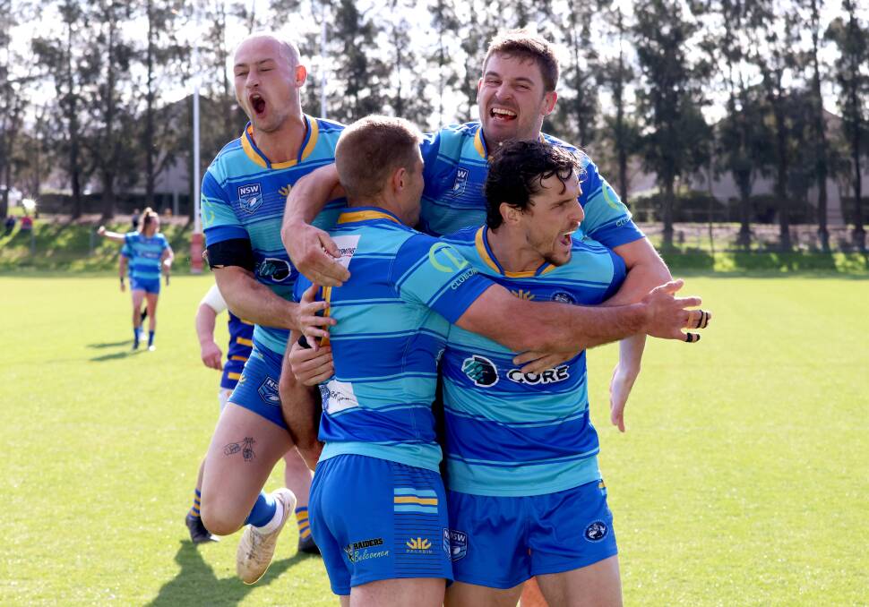 The West Belconnen Warriors celebrate Ryan McQueen's try during Sunday afternoon's major semi-final. Picture by James Croucher