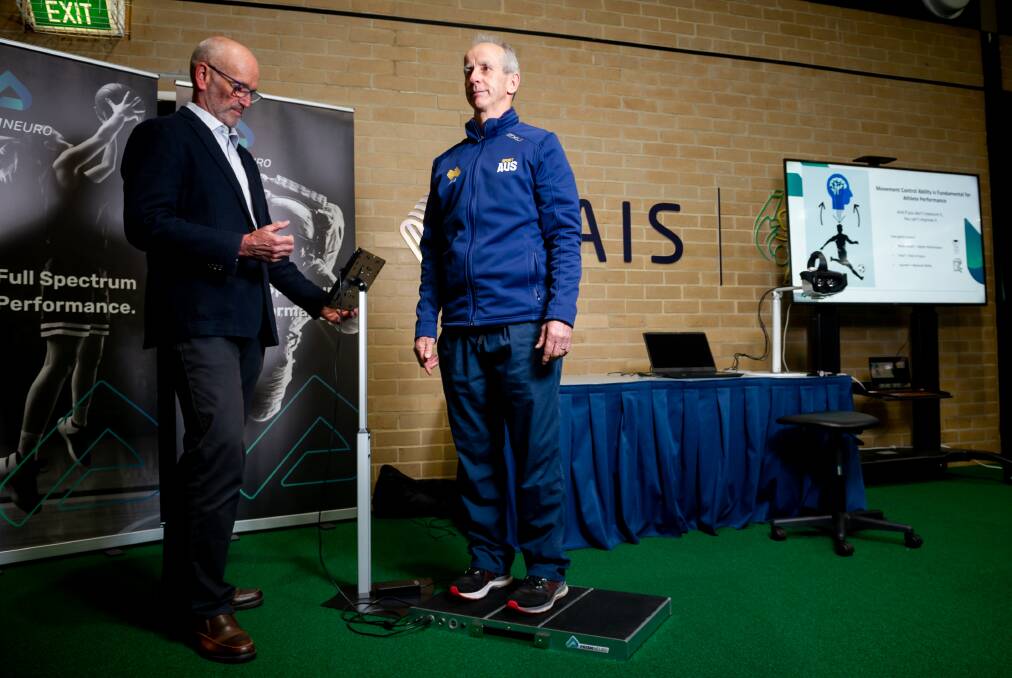 Prism Neuro co-founder professor Gordon Waddington and AIS chief medical officer, Dr David Hughes, demonstrate the new technology at the launch of the ground-breaking sports technology. Picture: Elesa Kurtz