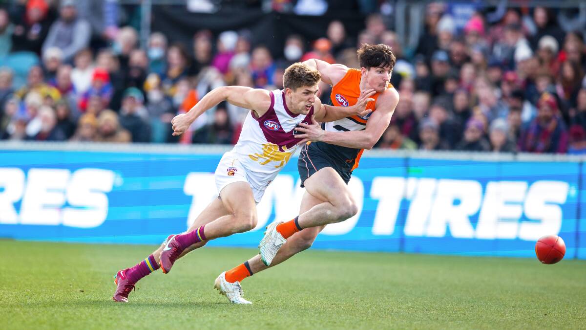 GWS Giants' defender Sam Taylor and Brisbane Lions' Zac Bailey contest for the ball at Manuka Oval. Picture: Sitthixay Ditthavong