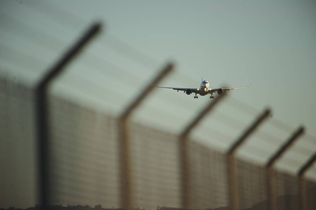 A repatriation flight from Singapore lands at Canberra Airport on Monday, March 1. Picture: Dion Georgopoulos