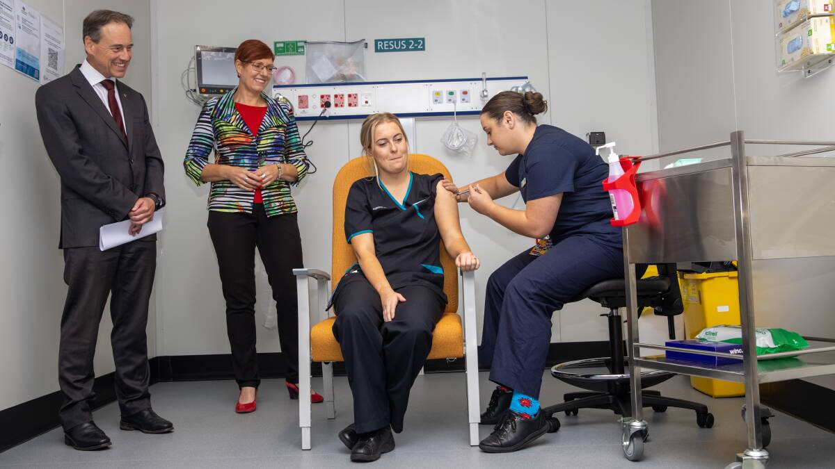 Canberra nurse Maddy Williams was the first person in the ACT to get the Pfizer vaccine at the Garran Surge Centre. Picture: Keegan Carroll