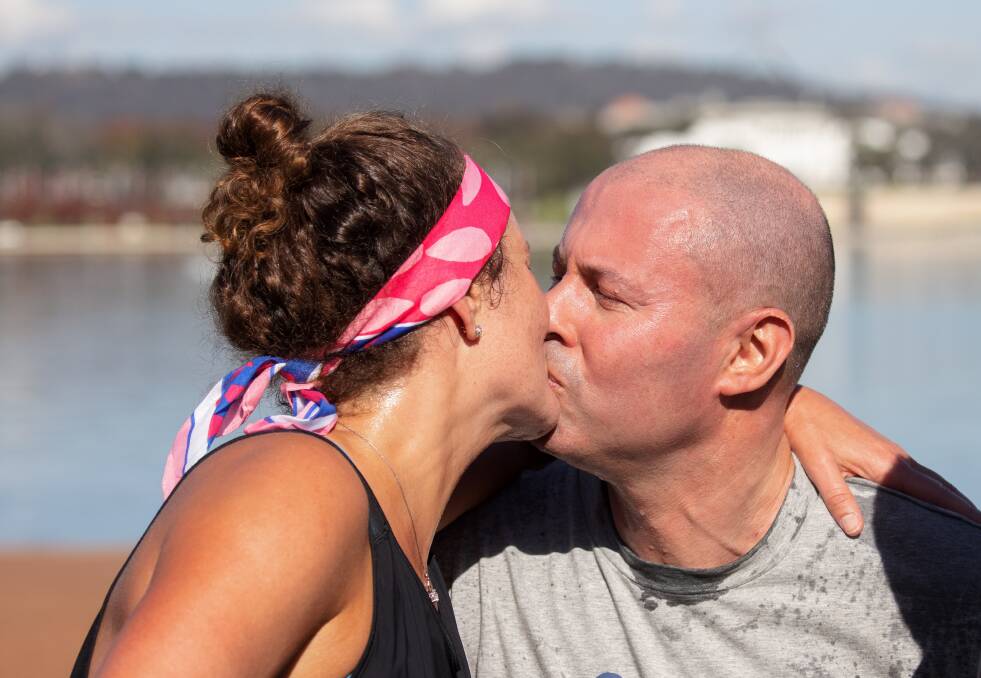 Treasurer Josh Frydenberg with wife Amie after running the Mother's Day Classic. Picture: Sitthixay Ditthavong