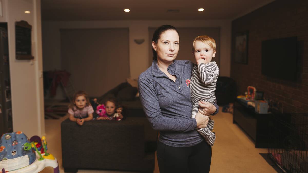 Kathryn Sliwinski with her son Harry, who has been sick several times since April, along with her daughters Elle (4) and Eve (6). Picture: Dion Georgopoulos