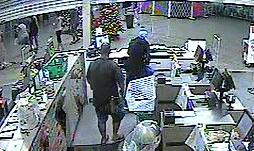 A bystander approaches Joshua Sullivan as he attempts to rob Woolworths at Calwell. Picture: Supplied, CCTV