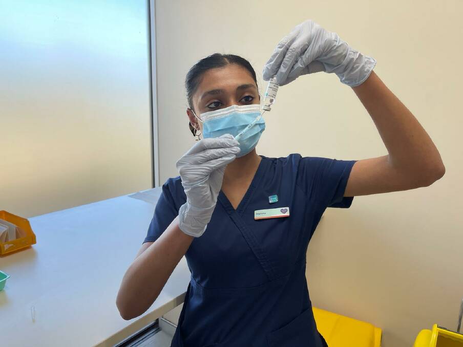 Nurse Marisha Christian draws up a vaccine dose at the new Calvary clinic. Picture: Charlotte Harper 