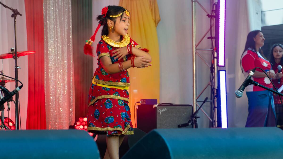 Rayne Pokharel 7, performs a Nepalese dance at the festival. Picture by Elesa Kurtz