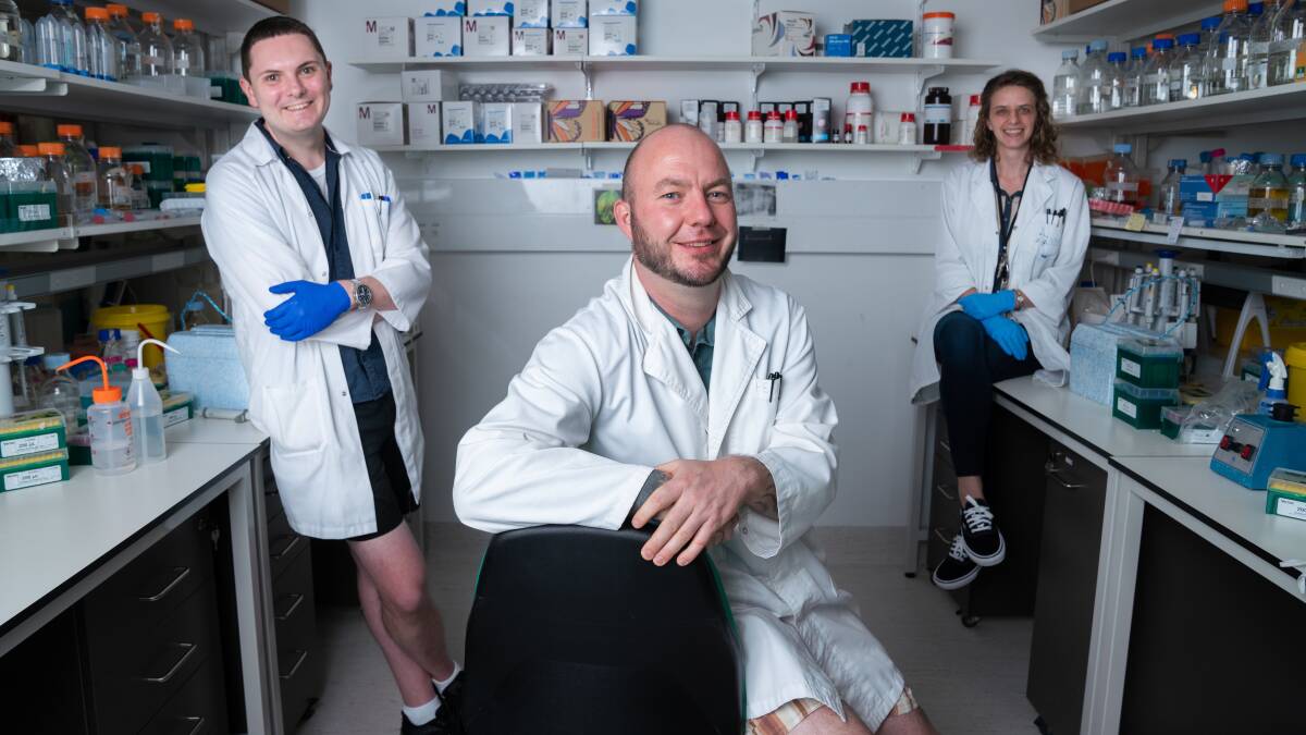 Dr Benjamin Schwessinger, centre, Emma Crean and Dr Ashley Jones, left, are part of a team who have mapped the genomics of Canberra's COVID-19 outbreak. Picture: Tracey Nearmy (ANU) 