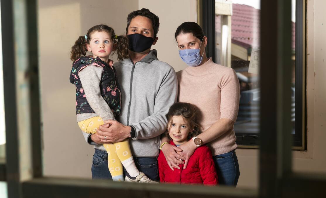 Simon O'Mahony, Anna O'Mahony and their children Mia, 6, and Chloe, 3, are confined to one bedroom as renovations cannot proceed in the current ACT lockdown. Picture: Keegan Carroll 