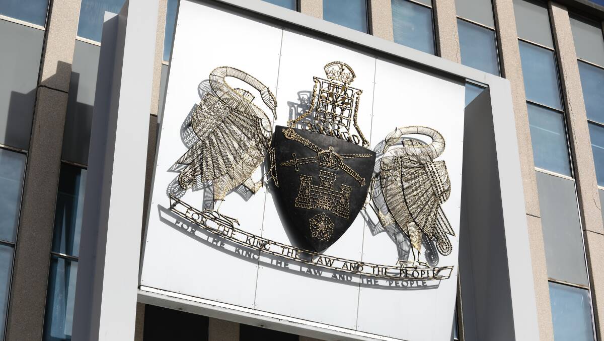 Canberra's Coat of Arms on the Legislative Assembly, which already has the motto "For the King, the Law and the People". Picture by James Croucher 