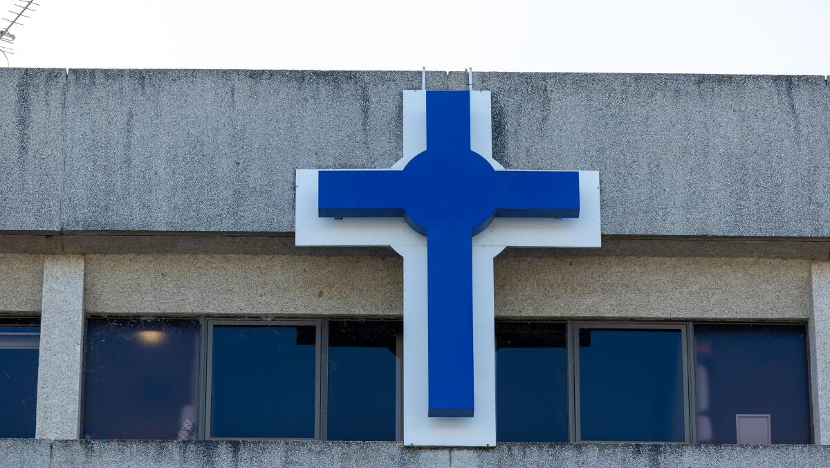A cross on the front of Calvary Public Hospital Bruce. Picture by Gary Ramage 