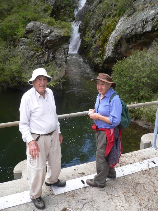 Stan Goodhew (left) and long-time friend Doug Wright during a walk to the Southern Cloud wreck site in the Snowy Mountains in November 2011. Picture: Matthew Higgins