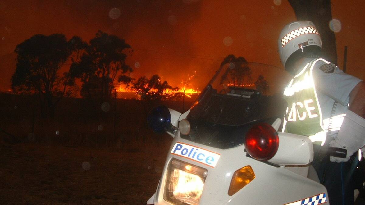 Acting City Station Sergeant Jeff Knight on his police bike during the bushfire. 